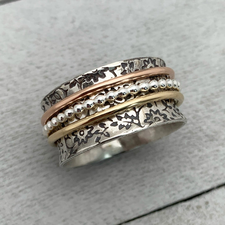 Sterling Silver Flower Spinner Ring with Yellow and Rose Gold Fill. Size 9.5 US
