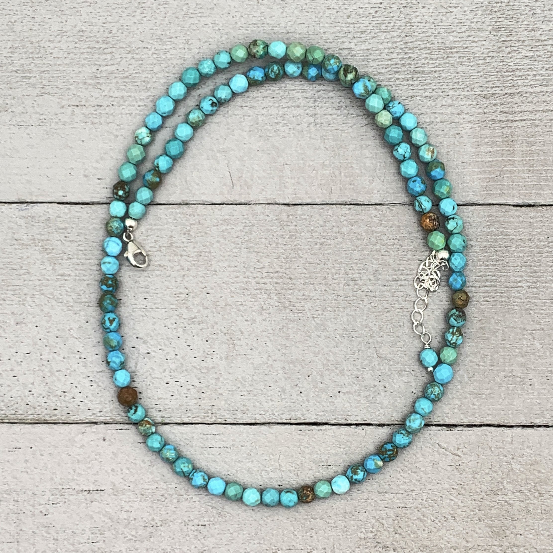 This store necklace features beautiful faceted natural turquoise beads and sterling silver clasp